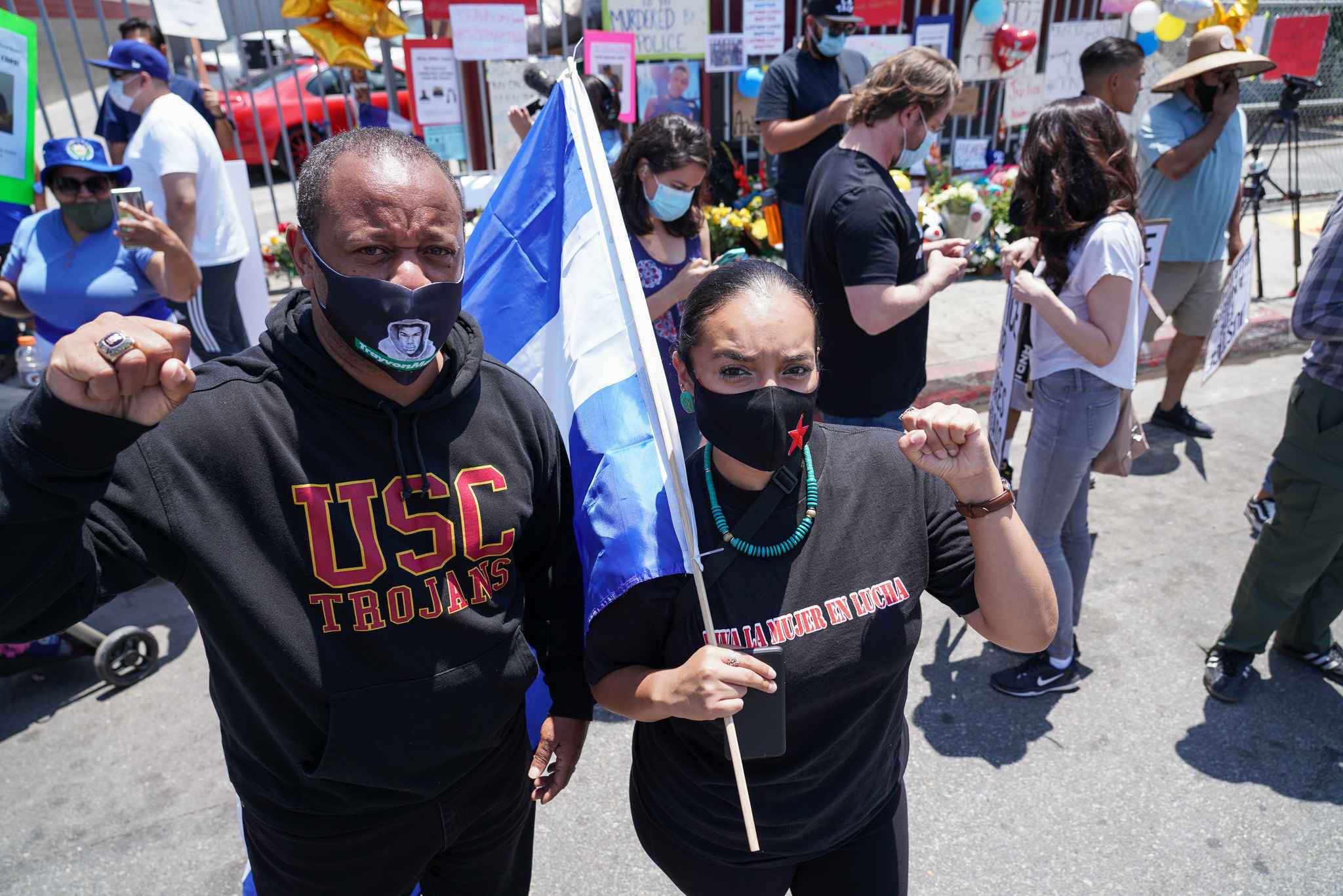 Long time South L.A. activist Najee Ali (left) joins forces with Unión del Barrio Immigrant Advocacy Group Desiree Gaytán (right) before the march started. Photo: Francisco Lozano