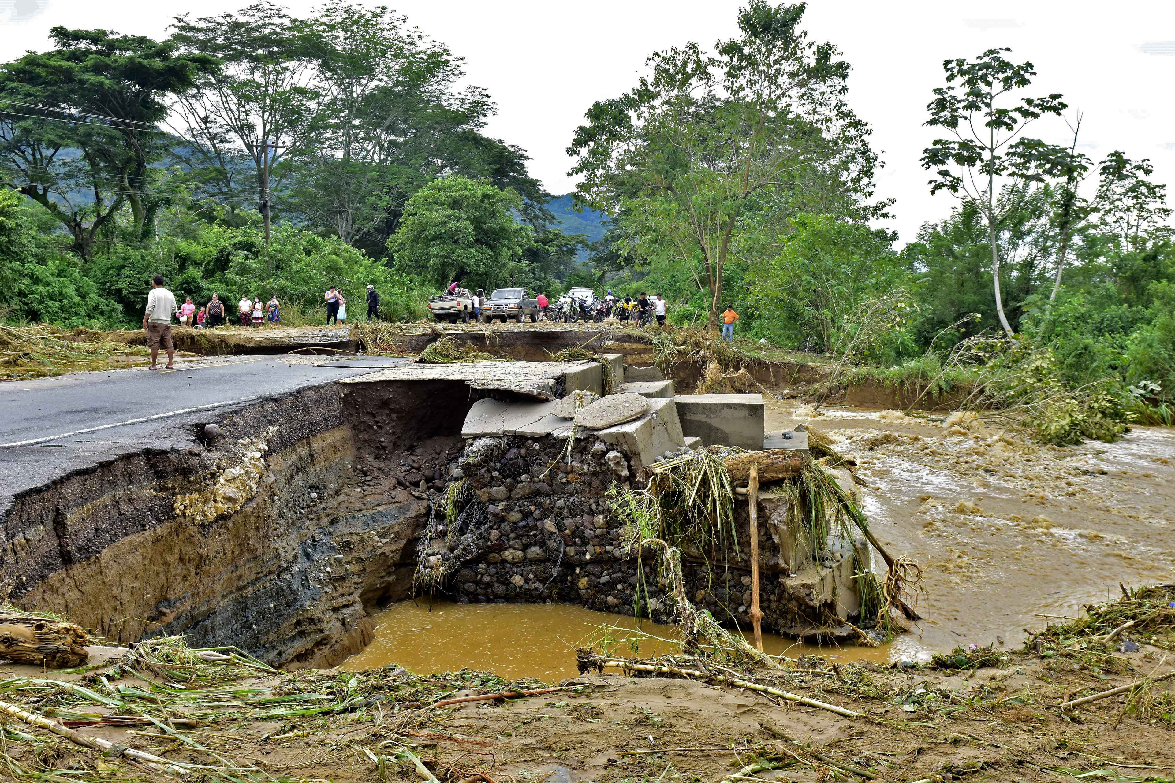 View of a crack blocking a road in El Progreso, Yoro department, Honduras on November 5, 2020, after the passage of hurricane Eta. (Photo by - / AFP)