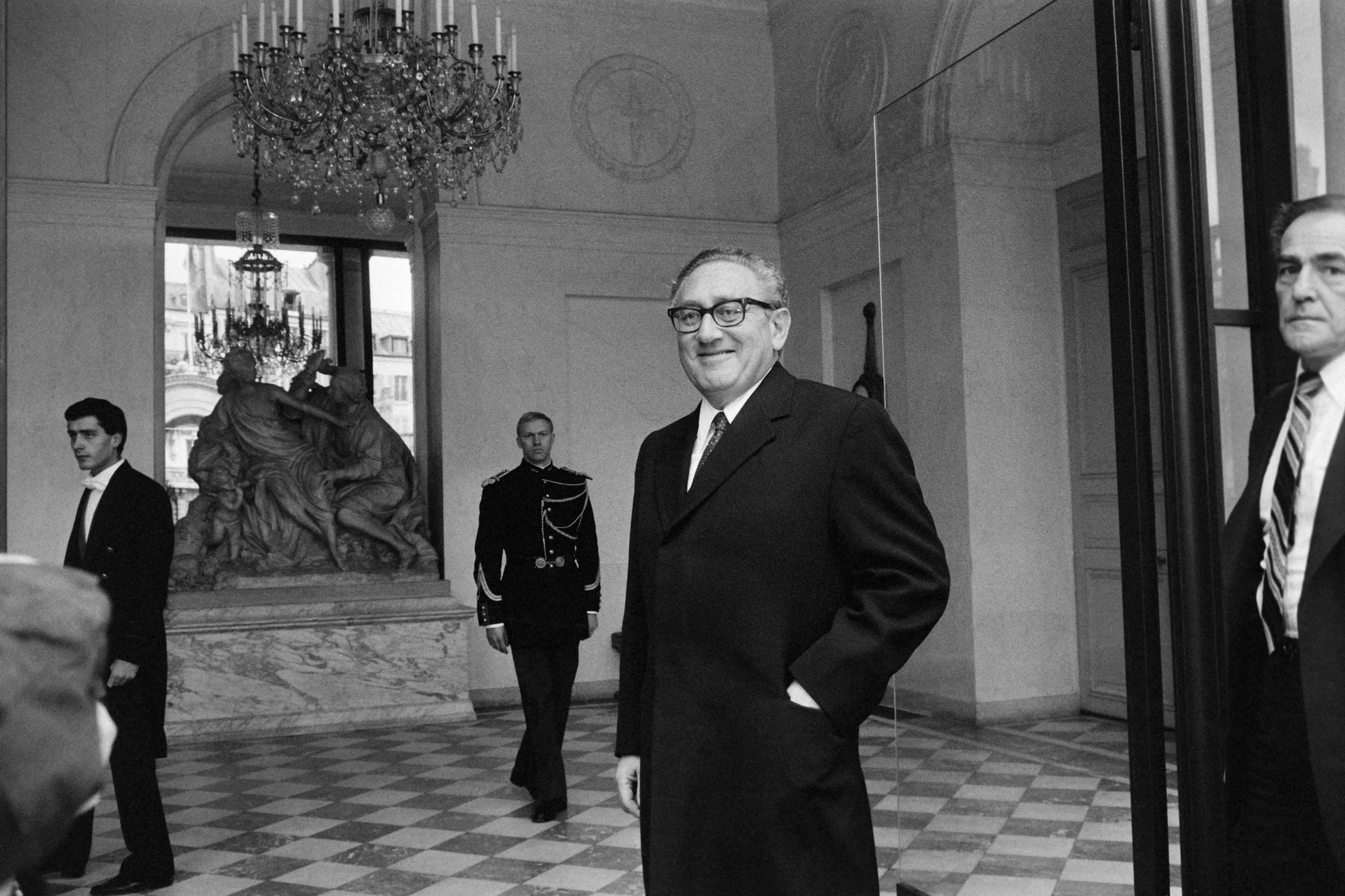 Henry Kissinger, Ronald Reagan's Head of the U.S. Presidential Commission on Central America, smiles after meeting French President François Mitterrand at the Élysée Palace in Paris on November 26, 1983. Photo Michel Clément/AFP