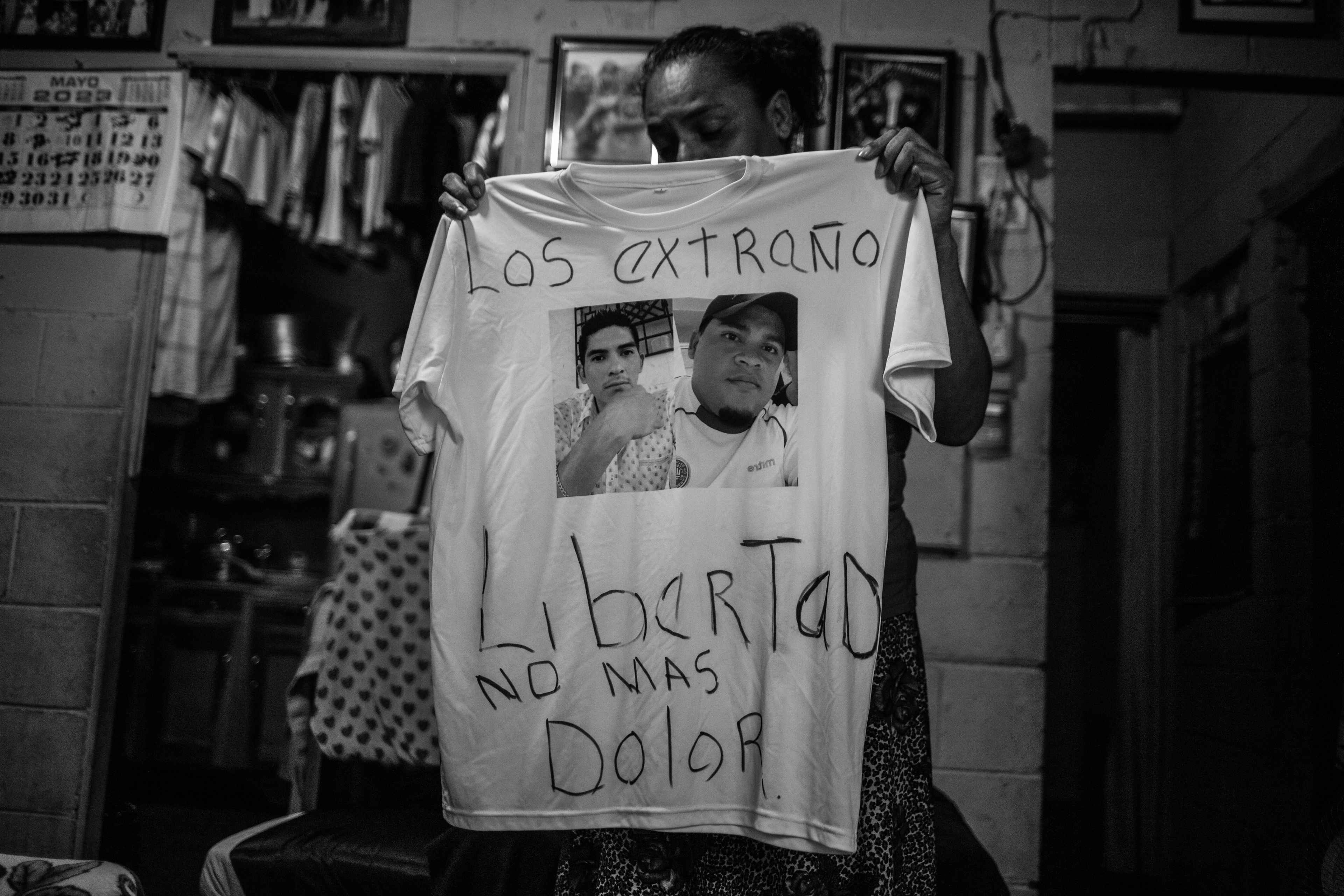 Cecilia Ábrego holds a T-shirt with a photo of her children who were captured during the regime. Cecilia suffers from cancer and must raise money for her treatment and send packages to her detained children. In addition, after the arrests, she had to take care of her grandchildren.