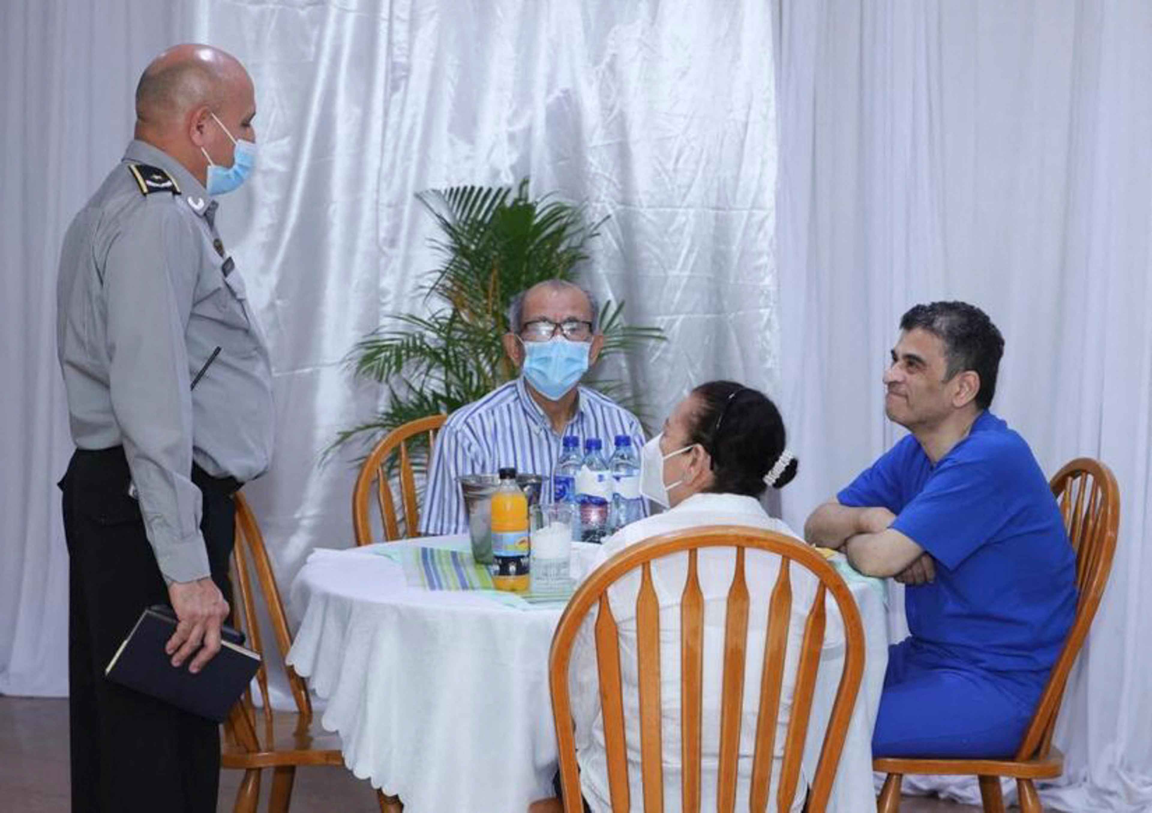 Handout by Nicaraguan state media outlet El 19 Digital showing Nicaraguan Bishop Rolando Álvarez (right) eating with his siblings Vilma and Manuel Antonio at the Jorge Navarro prison in the outskirts of Managua, on Mar. 25, 2023. Two weeks earlier, a Nicaraguan court sentenced the Catholic bishop to 26 years in prison after he refused to board a U.S.-bound plane carrying 222 political prisoners into exile. Photo El 19 Digital/AFP
