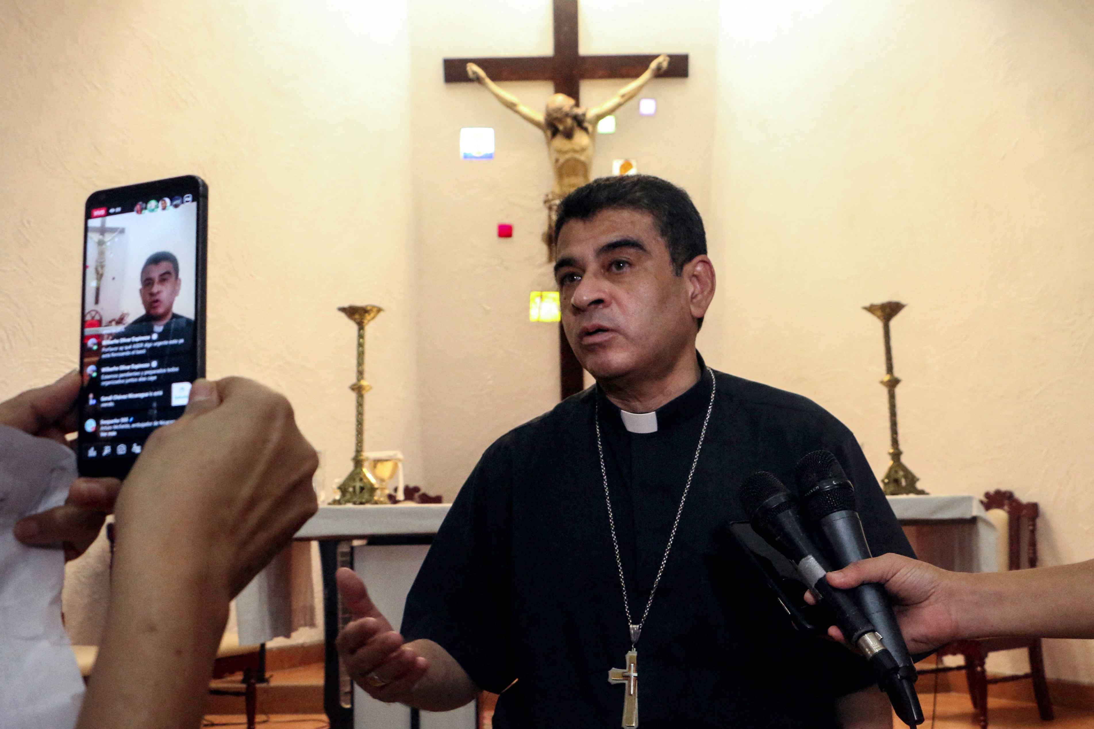 Matagalpa Bishop Rolando Álvarez speaks to the press at the Santo Cristo de Esquipulas Church in Managua, on May 20, 2022. Álvarez, a strong critic of Daniel Ortega's government, had started a hunger strike in protest against what he considered a police siege against him. Photo AFP