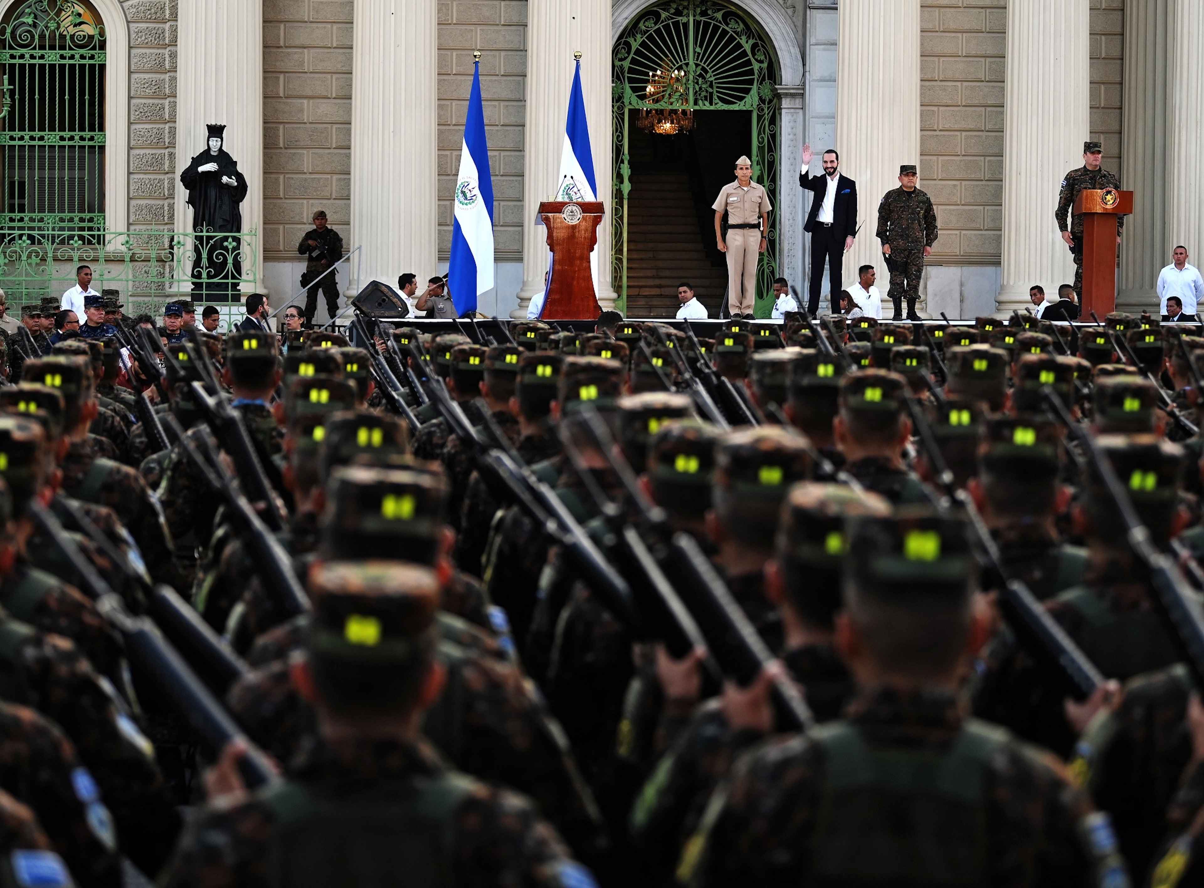 Salvadoran President Nayib Bukele waves at soldiers joining the Armed Forces at Gerardo Barrios Square in the Historic Center of San Salvador, on July 29, 2019, two months after he took office. Photo Marvin Recinos/AFP